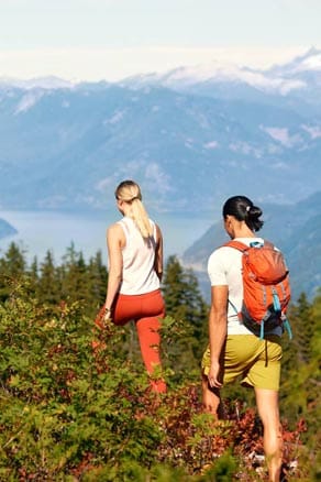 couple hiking on cypress mountain on a sunny day