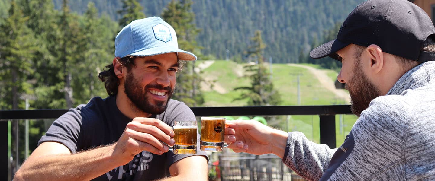 group of people drinking beer on a patio